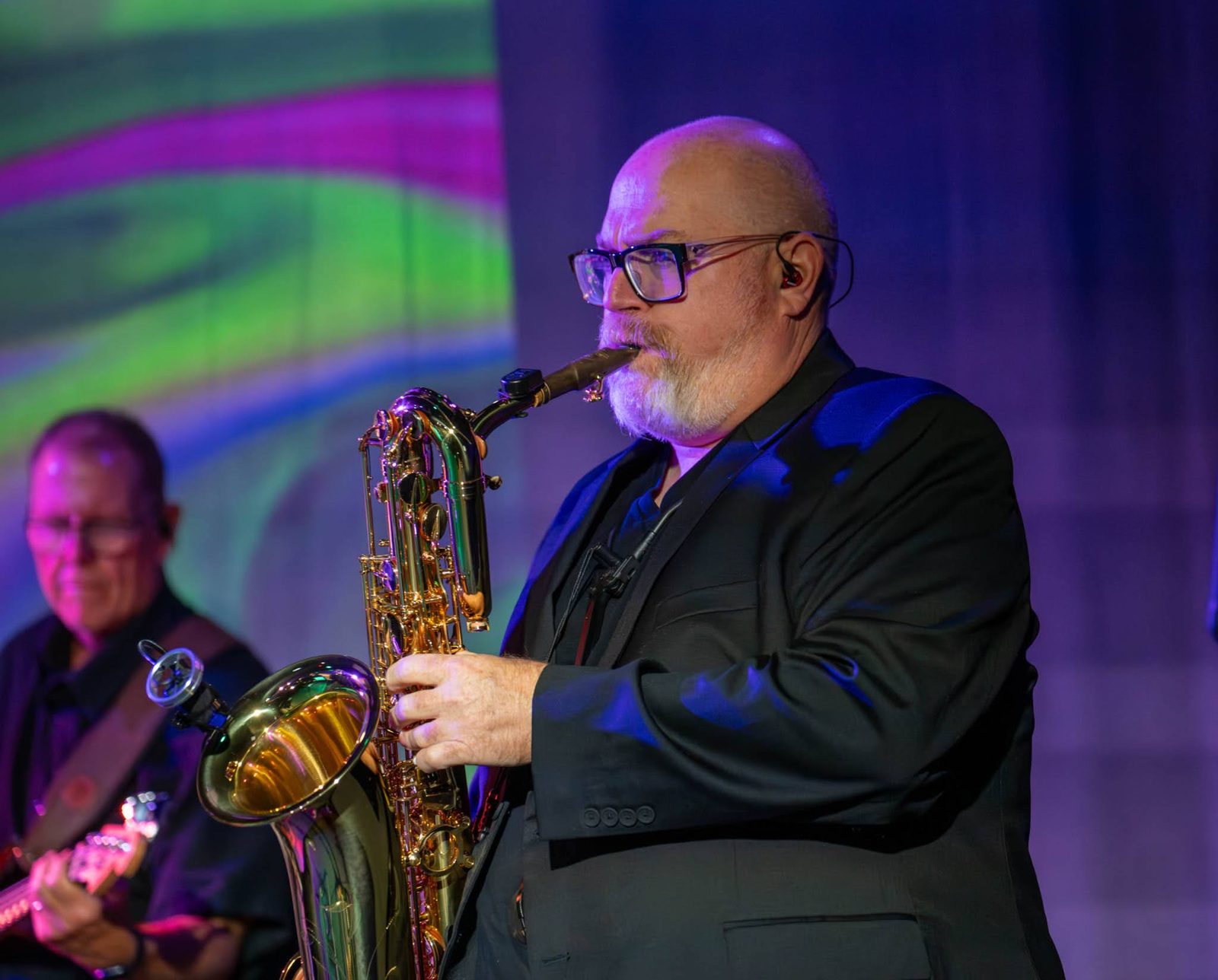 Steve Wilson playing saxophone in a jersey themed show