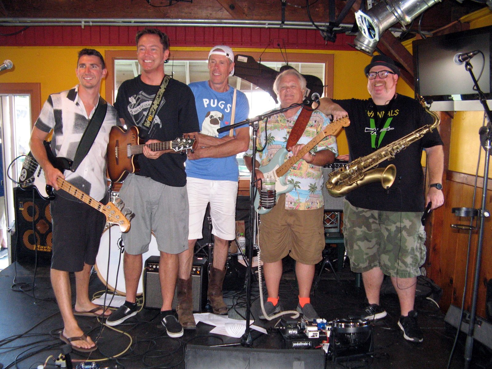 Steve Wilson with the band and saxophones outdoors