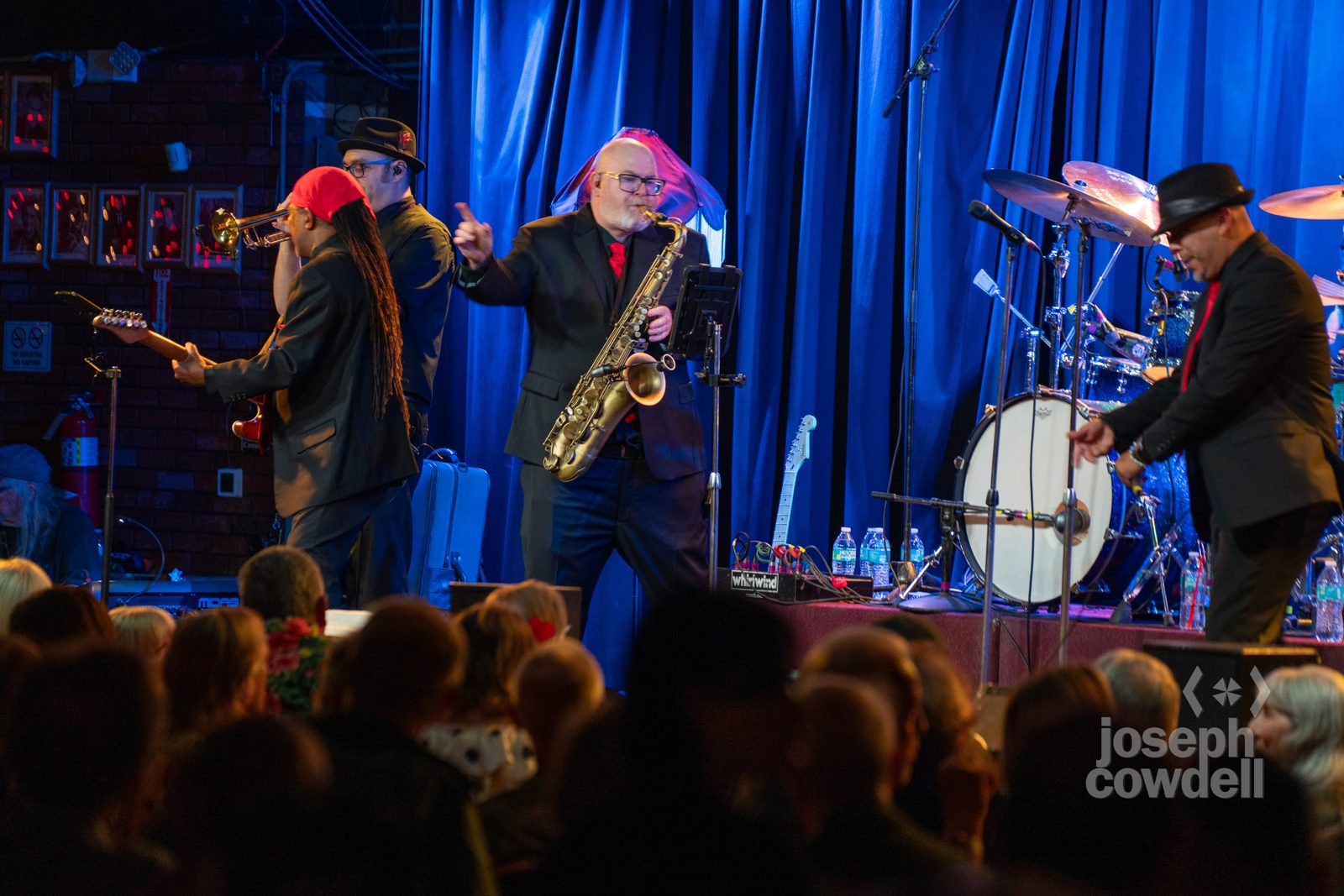 Steve Wilson playing sax with the band in front of a full house