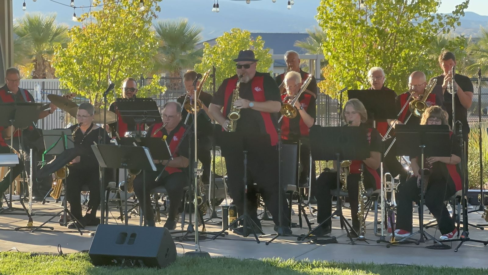 Big band performing outdoors on a sunny afternoon