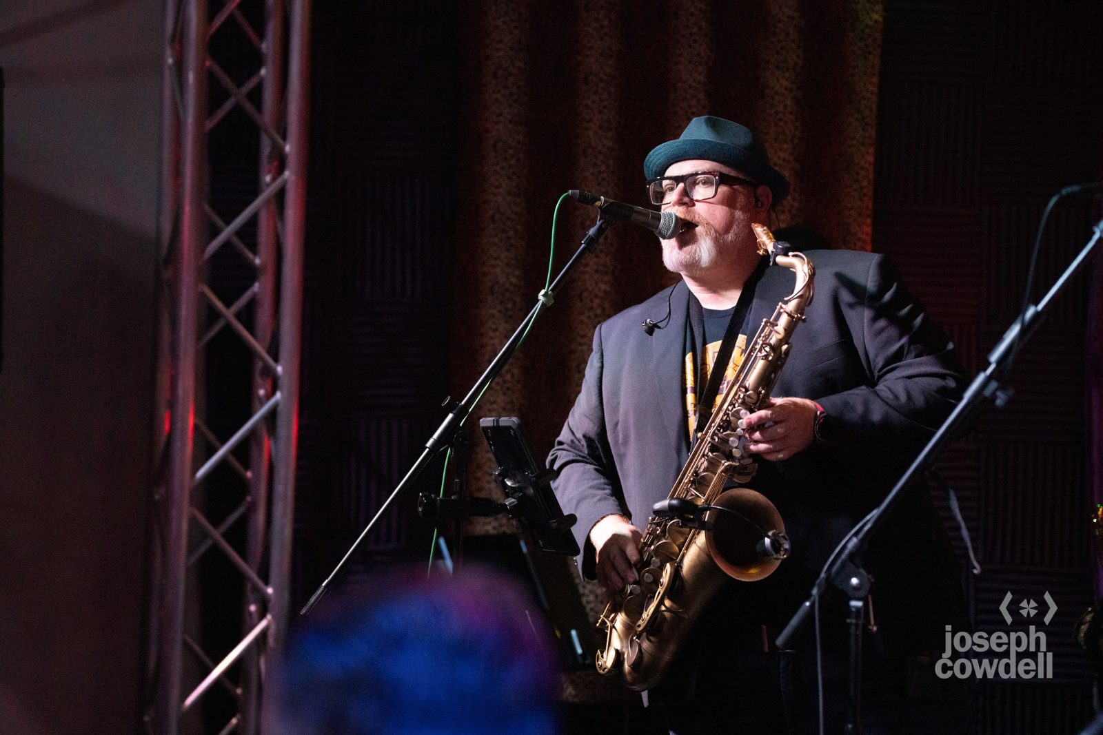 Steve Wilson soloing on saxophone in a hat and suit