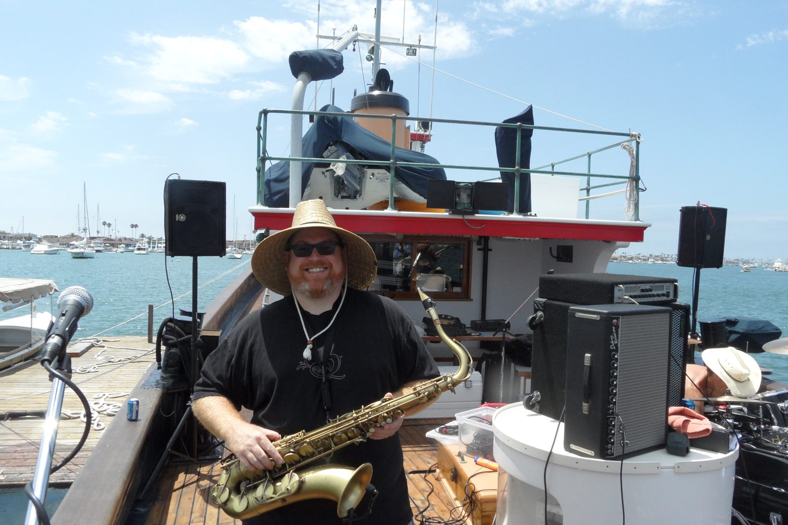 Steve Wilson playing saxophone at a harborside gig