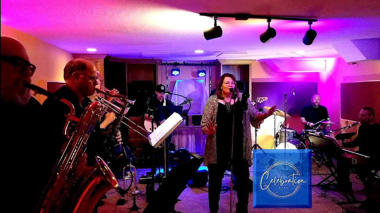Horn section with baritone saxophone and trumpet during a Celebration Band set