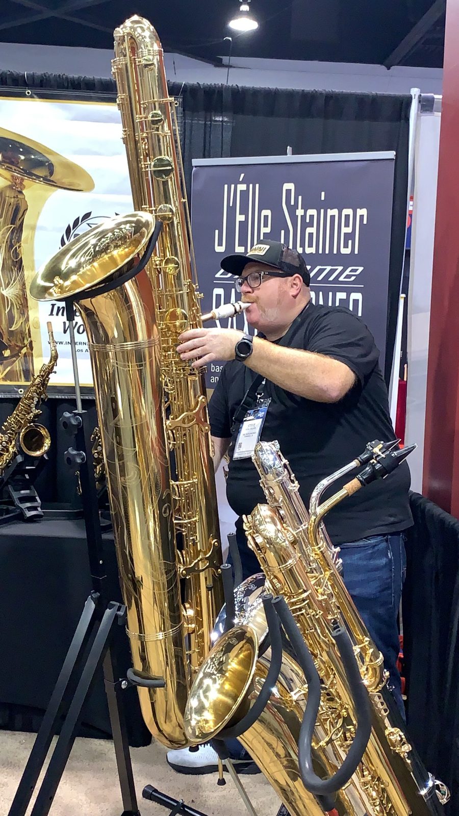 Steve Wilson with baritone and tenor saxophones at a music expo